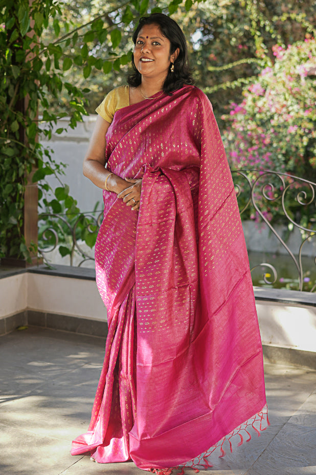 Woman in a pink Tussar Silk Handloom saree