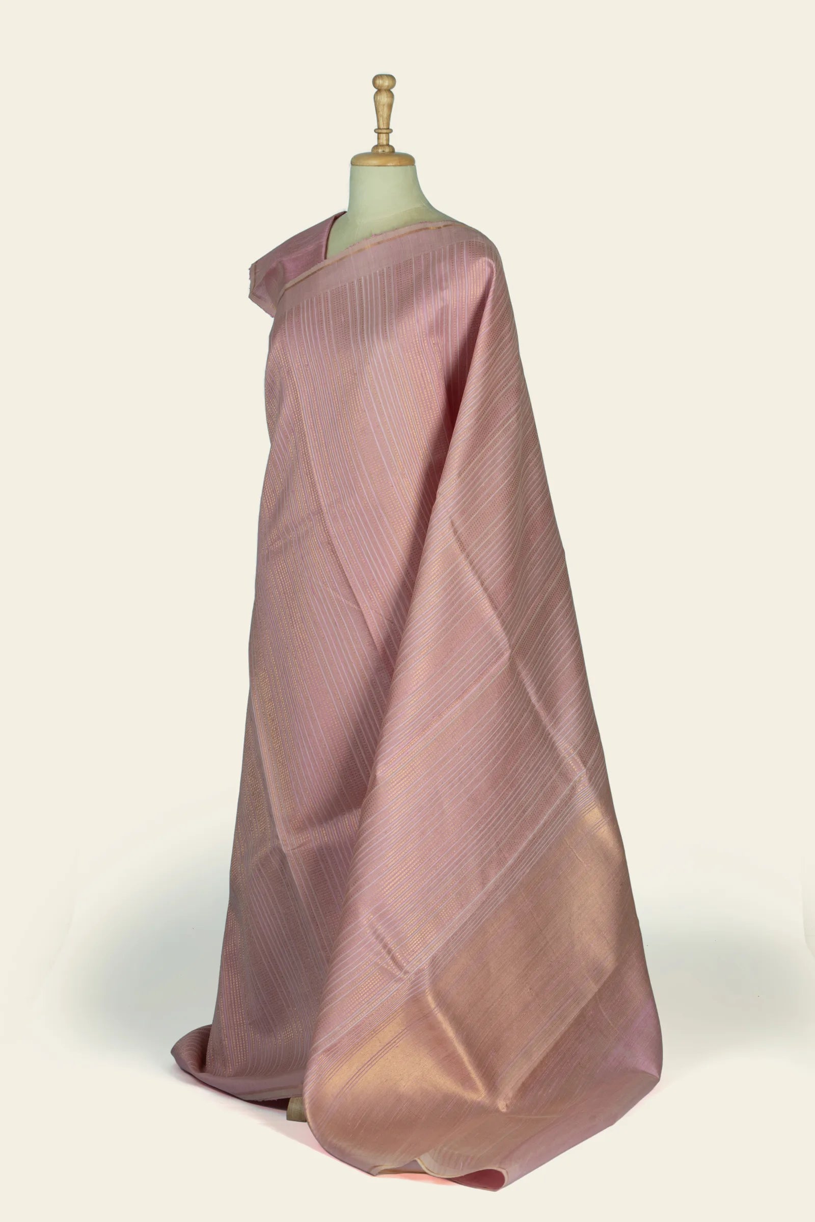 Side-angle view of the saree showing pallu fall and overall vertical stripe pattern.