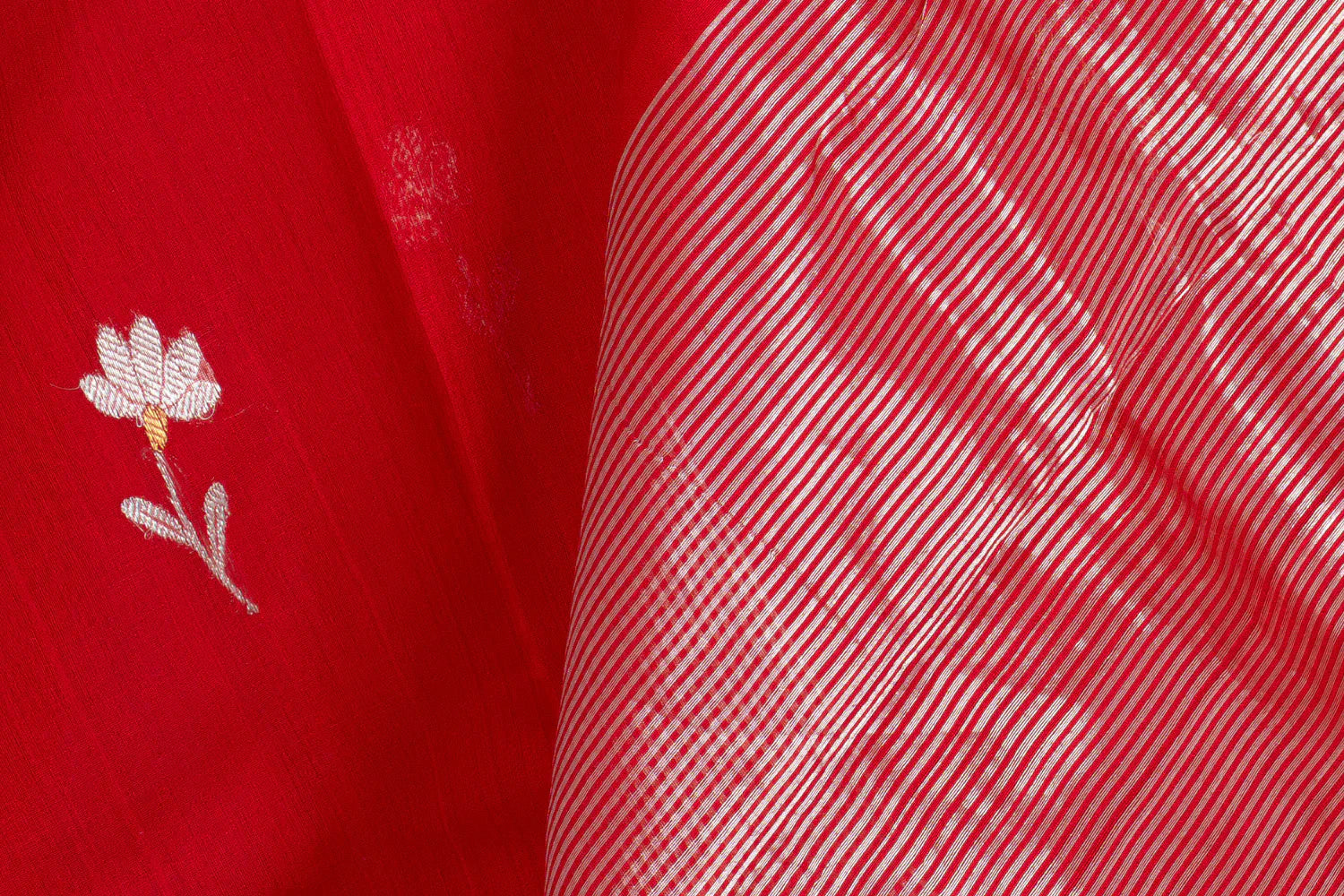 Red Handloom Chanderi saree showing flower motifs and stripes in pallu